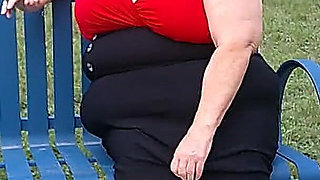 Nurse Vicki Smoking in the Park on a Bench All Dressed up