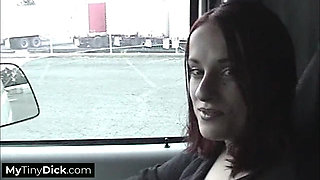 A hot big tits babe sucking his small dick in the car