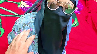 A slut in a hijab spread her legs in front of her husband with a big dick