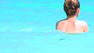 Smoothest nudist play in the warm water  at a nudist beach
