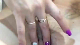 Undressed in a doggy style masturbation and pissing on the toilet close up