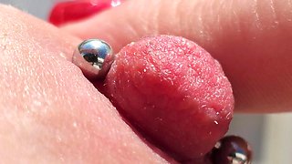 Playing Pierced Nipples Close up on Balcony