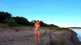 Russian Nudist on the River Shore