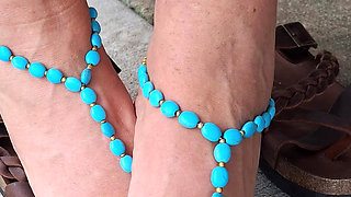 Showing off her soles and cute barefoot sandals
