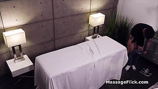 Hot MILF gives secret handjob under massage table - big boobs spy cam