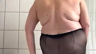 Mature stepmom with big tits playing with dirty pantyhose in the shower