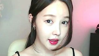 Busty Korean teen camgirl in pantyhose masturbates
