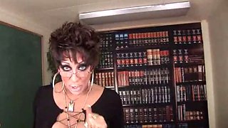 Mature transvestite beats her rock-solid cock in the classroom