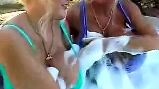 Blonde is flashing her big boobs in the outdoors