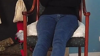 Worshiping the feet of a girl in blue jeans