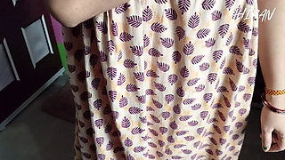 Indian Girl Folding Clothes in Her Bedroom