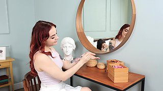 A cute long-haired girl in a mini-skirt plays with her pussy with toys.