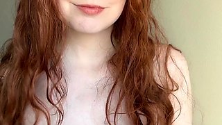 Amateur redhead Dasha with glasses masturbates