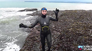Rubbery Beach Encounter: Lucy's Neoprene Pussy Play with Stranger
