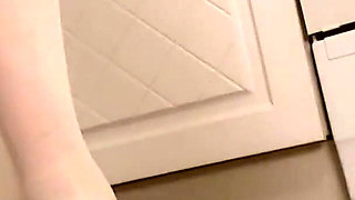 Hot housewife sexually rustles her apron in the kitchen