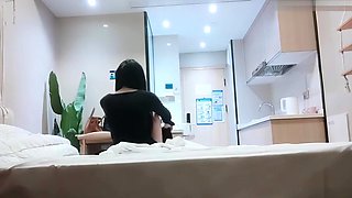 Cute amateur asian web cam girl playing with her toy