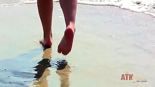 We follow Sinn Sage around the beach and then into the shower by ATK Girlfriends: Porn