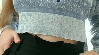 Hot blondie making a striptease at the bathroom and touching her boobs