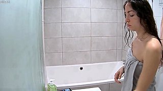 Hidden cam in the bathroom captures sexy stepmom naked