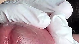 Glans Game with White Latex Gloves in Super-closeup. Alternative View.