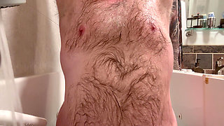 Big belly bear squirts through his jockstrap while fucking himself with a dildo!