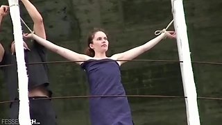 Bondage with a petite German girl in public nude