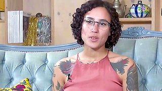 Tattooed dark haired with glasses enjoys hot solo