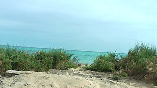 Watching on the beach as Isa has fun